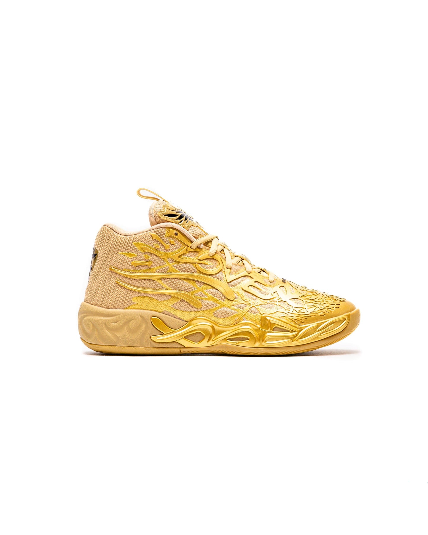 Gold sneaker with intricate design on a white background
